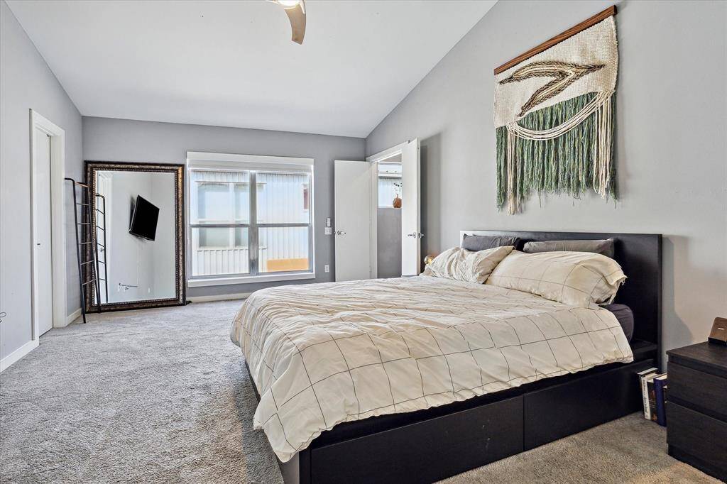 Primary bedroom with plenty of space for a loveseat or chair.