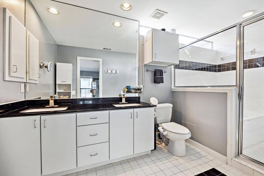 Primary bathroom - dual sinks and plenty of natural light