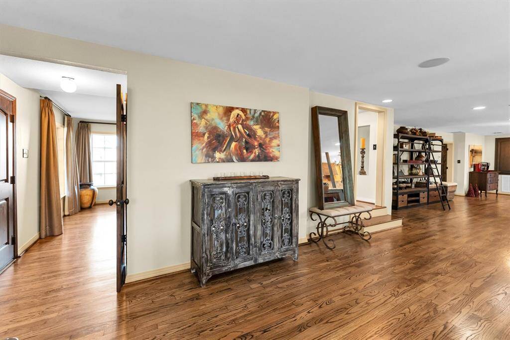From the front of living space left side entry flows to dining and then front stairs to upper bedroom wing