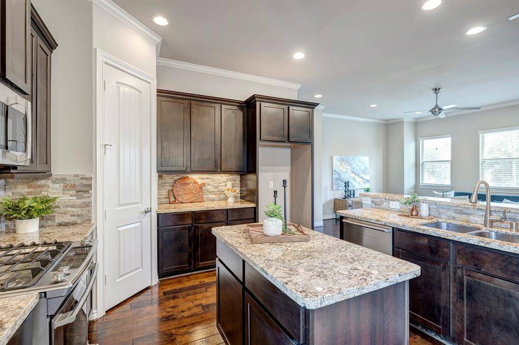 Island, abundant cabinet space and counter seating.