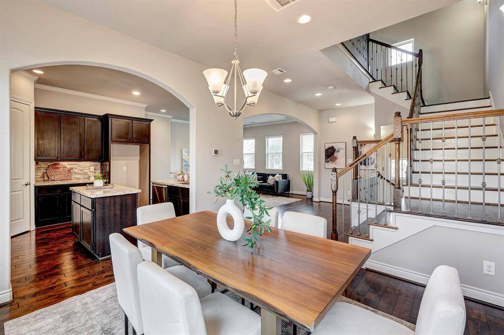 Another look from the dining area with high ceilings and crown molding.