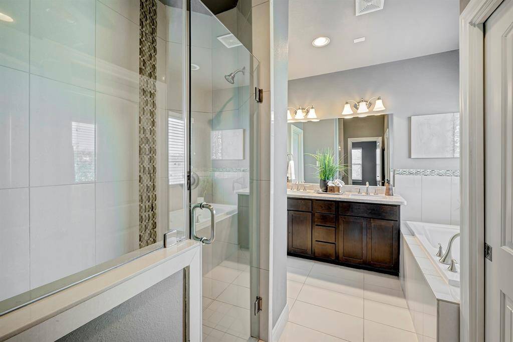 Another look at the primary bathroom with walk-in shower and private water closet.