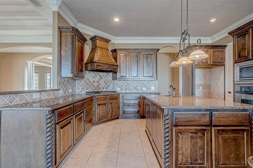 The center island offers extra storage and a handy prep sink.