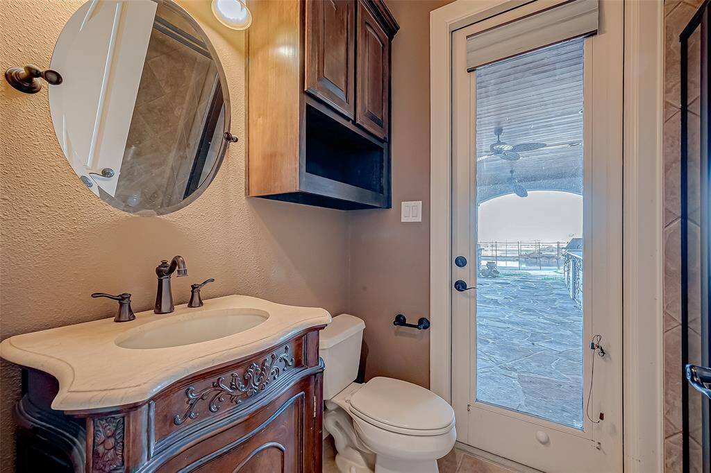 Guest Bathroom (Conveniently located by the backyard with easy access to the exterior outdoor kitchen and pool)