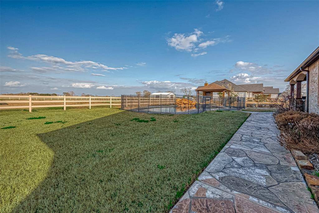 Walkway from parking area to backyard and pool.