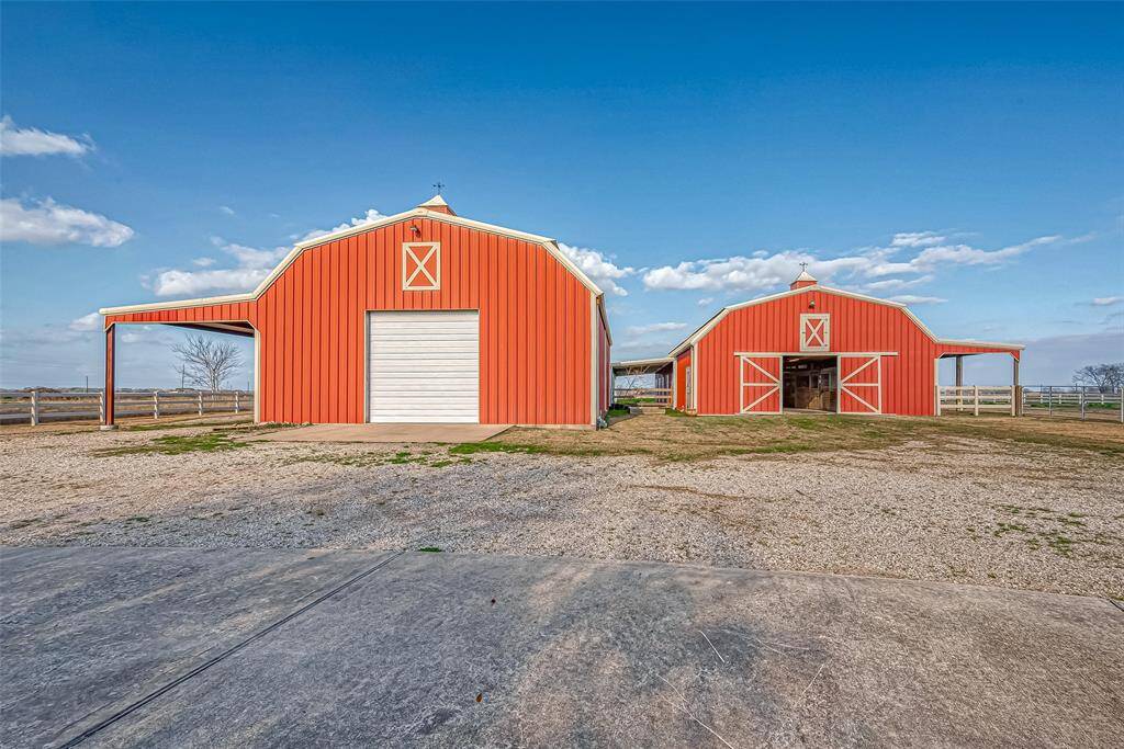 Shop and Barn with plenty of parking and easy area for turning trailers around.