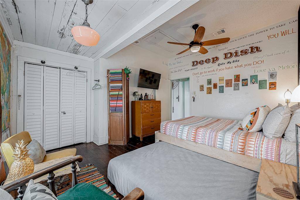 A full size secondary mattress pulls out from under main bed when extra company is over. Manager closet is organized with shelving to accommodate all the supplies needed to run the bungalow.