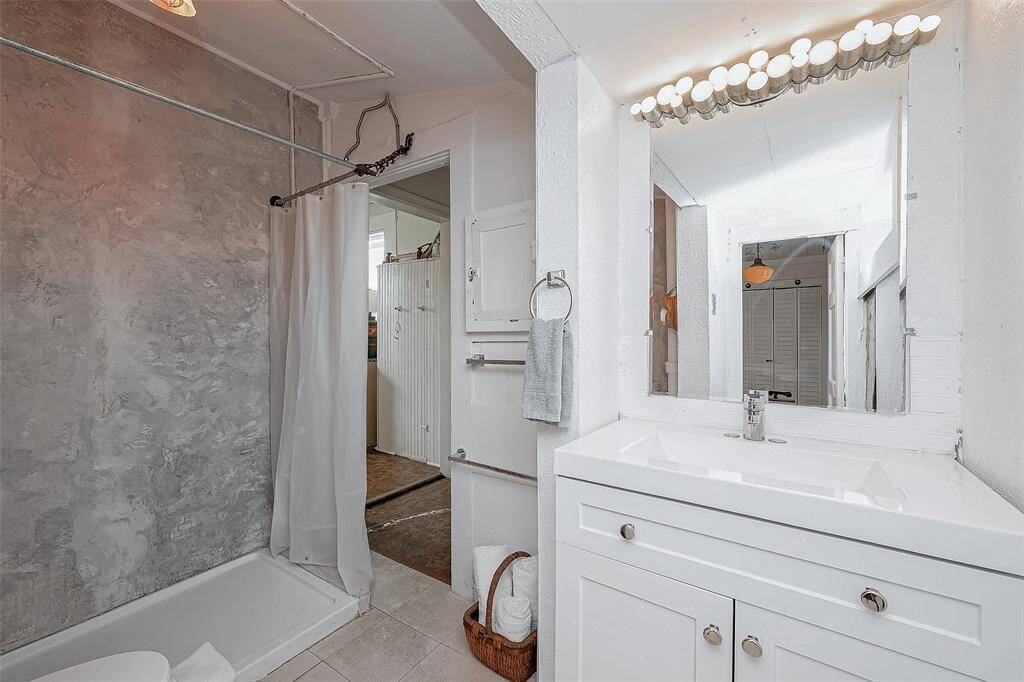 Enter the full bath through the bedroom or side of kitchen area, if you'd like to keep your bedroom private when guests come over.