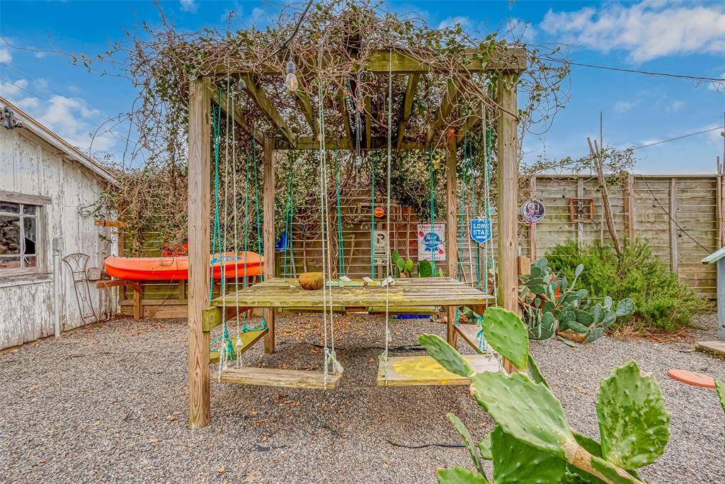 Tulum inspired swing seating. Star Jasmine vines atop the pergola fill the air with sweetness, come spring.