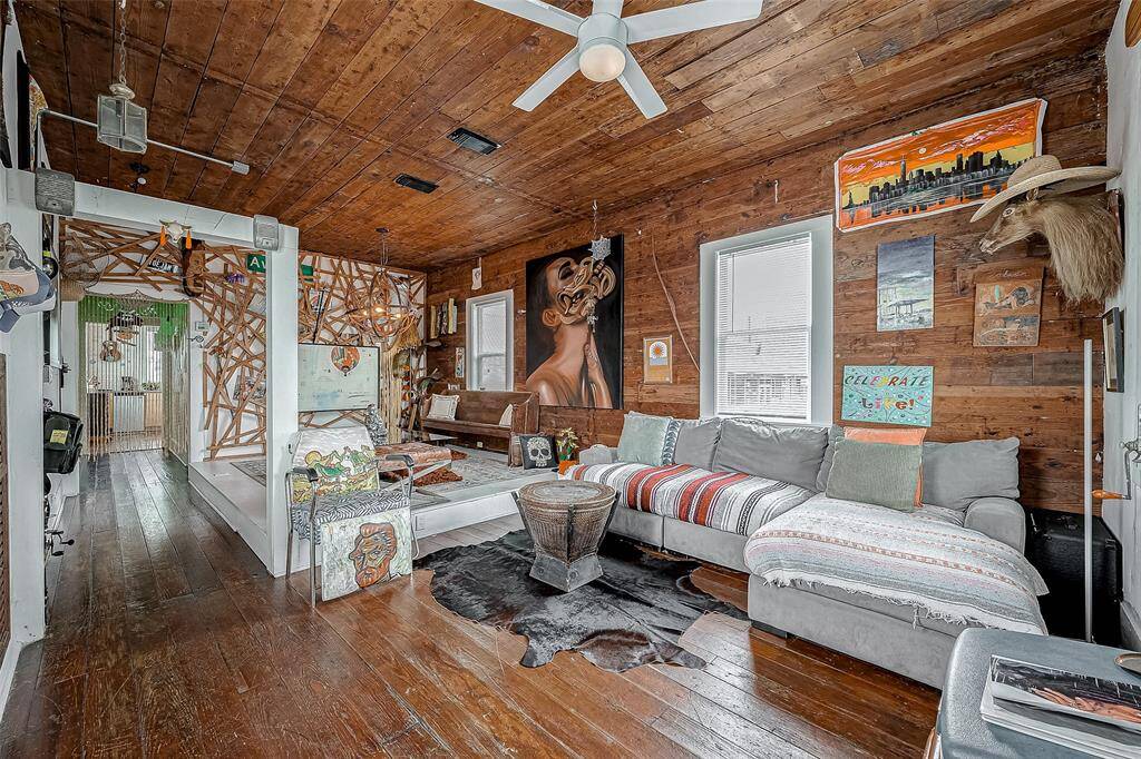 Enter into an open floor plan living space. Original Beams have been exposed. Art Everywhere!