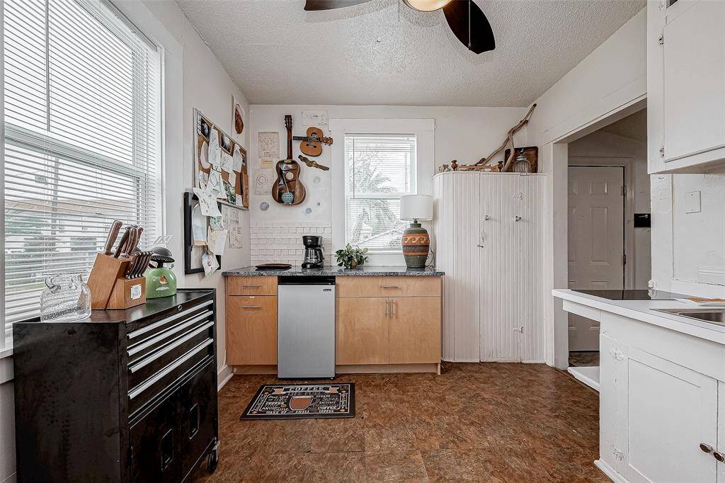 Fridge, Trash & cabinets are topped with an italian, blue marble countertop. Toolbox holds more cooking supplies and utensils. Our guests art is proudly featured on our corkboard on the wall.