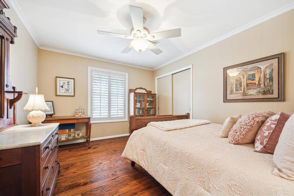 Guest Bedroom with Engineered Wood floors & Plantation shutters