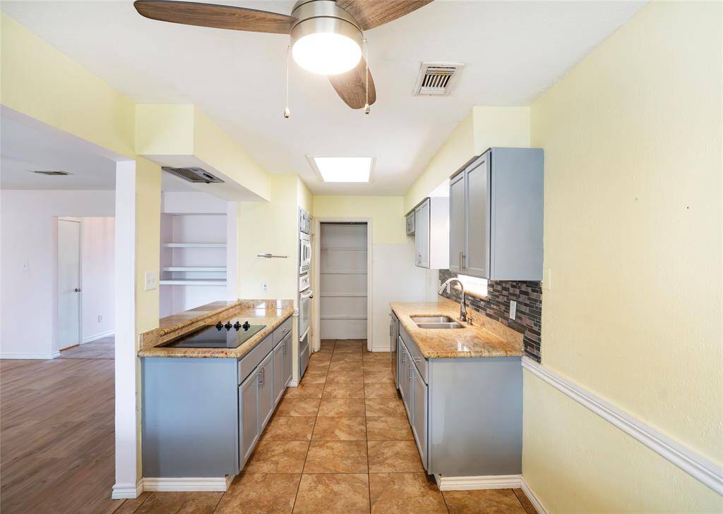 The kitchen/dining combo has two pantries, a double sink and a recently replaced dishwasher.