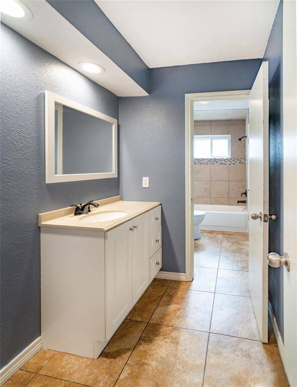 The primary bath can be accessed from the bedroom and from the hallway.