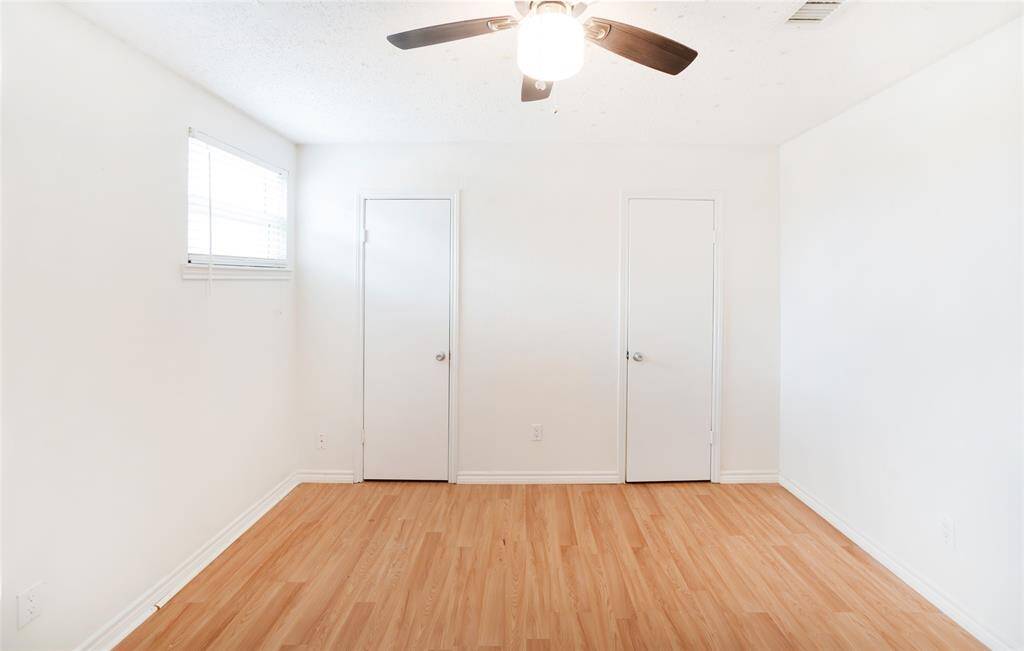 Bedrooms two and three have long closets that run the entirety of the double doors.