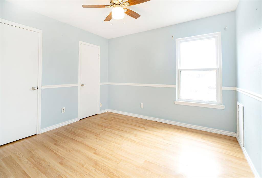 The third of four upstairs bedrooms.