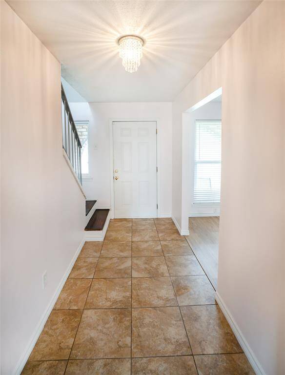 The entry is one of many spaces downstairs that is freshly painted.