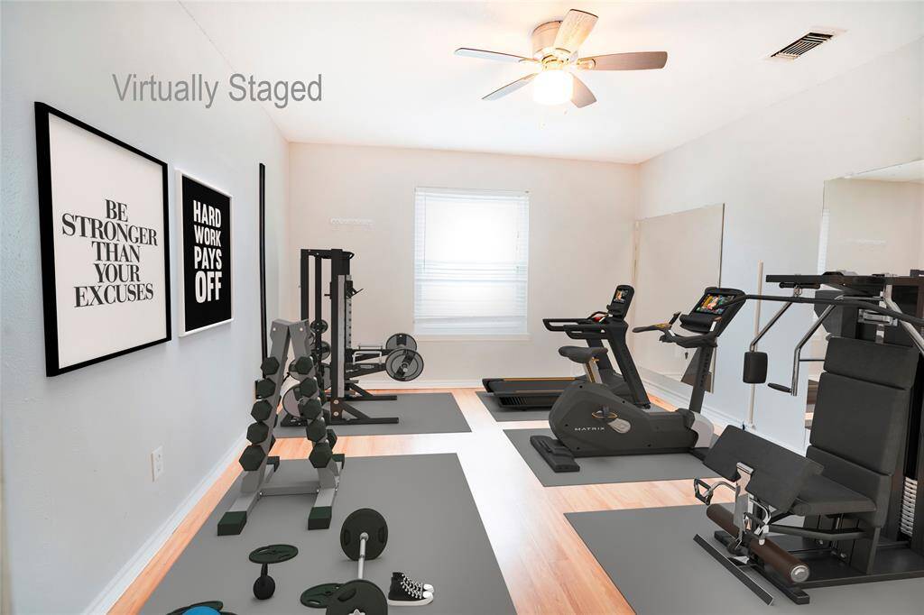 Bedroom four virtually staged as a workout room.