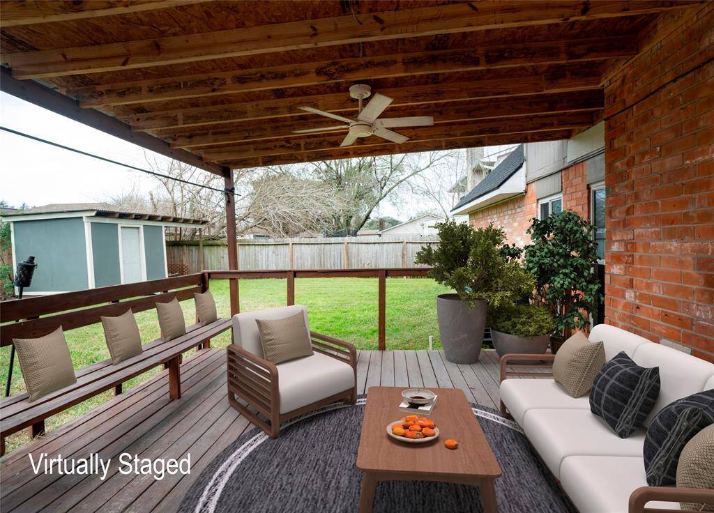 Virtually staged covered back patio.