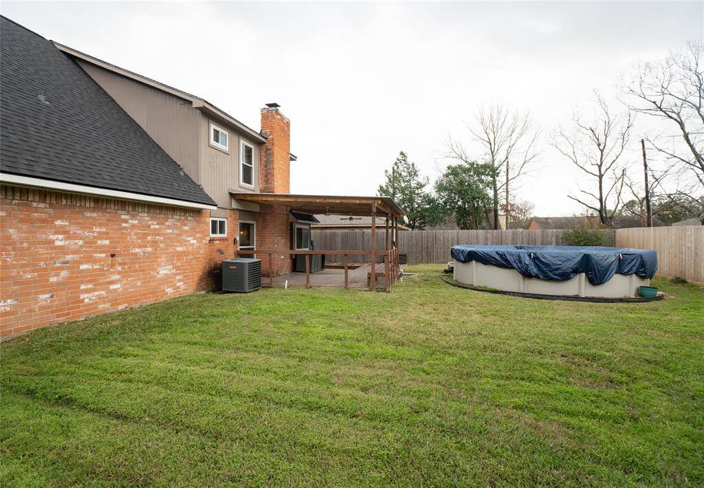 The above ground pool is in easy sight from the kitchen, living room and backyard.