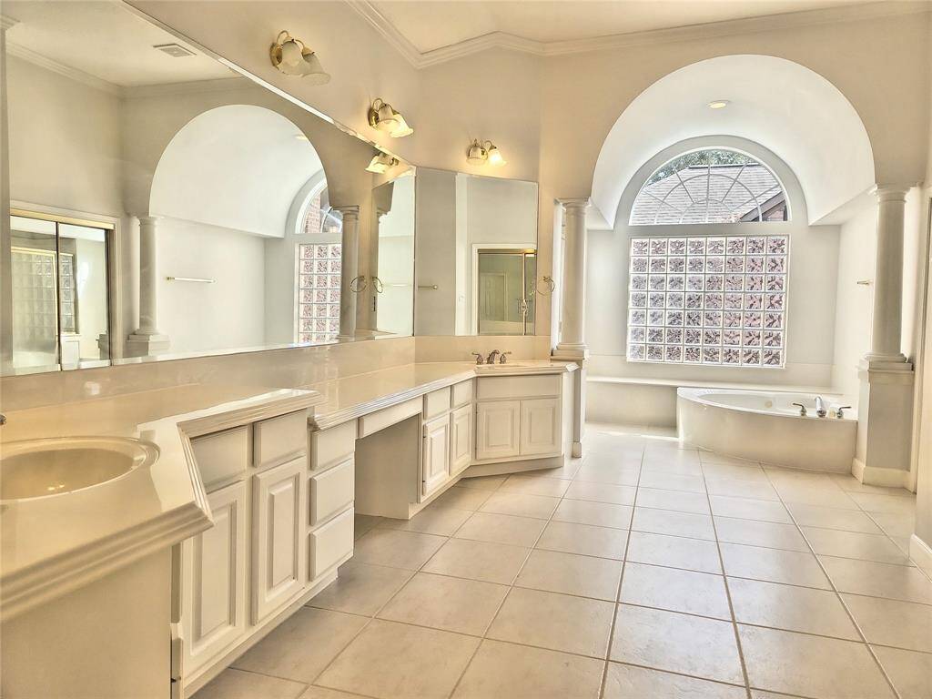 Lavish Primary Bathroom with Double Sinks, Soaking Tub & Separate Shower