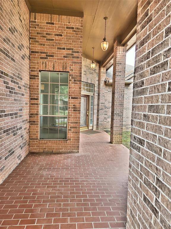 Covered Brick Patio to Courtyard of Home