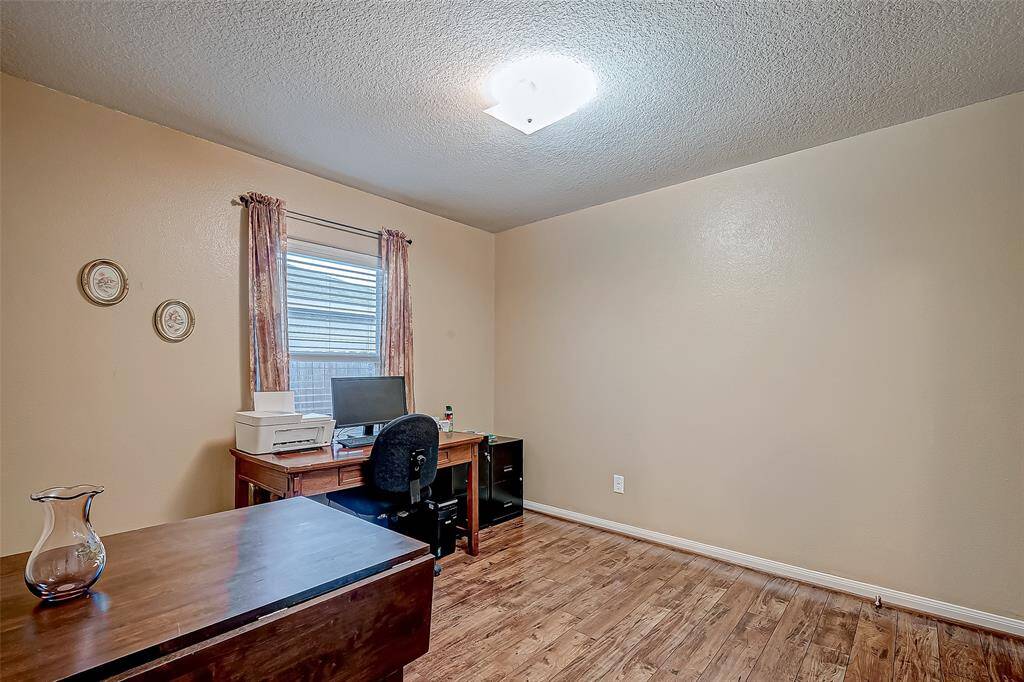 This room is a simple and functional space, ideal for a home office or study. It features beautiful flooring, a window for natural light, and neutral walls. Secondary bedroom 3 currently being used as an office.