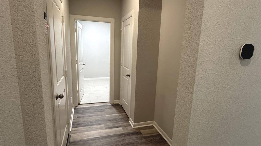 Just off the front entry is the mud space, hall closet, utility room and on the left side, access to the garage.