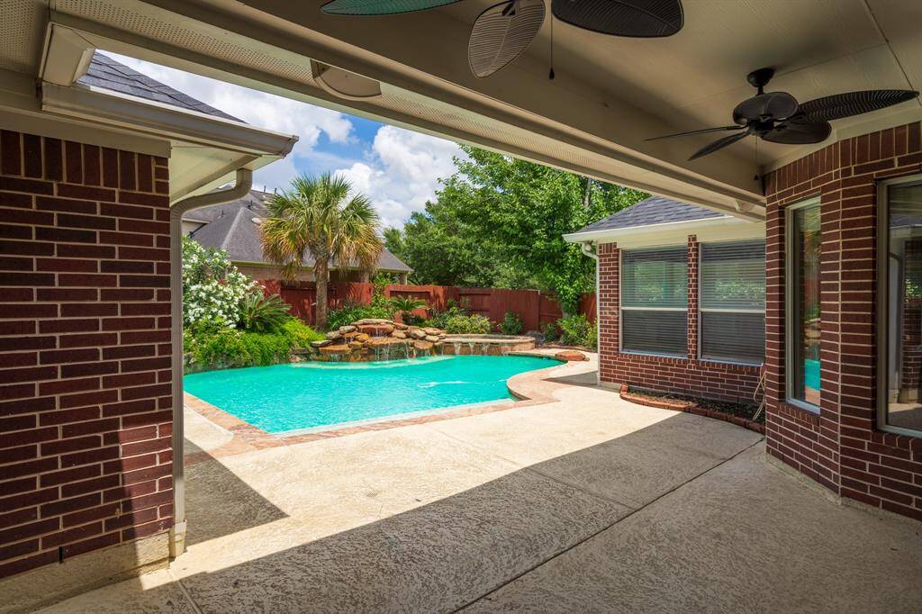 Enjoy your private oasis with a stunning pool, surrounded by lush landscaping and a spacious patio perfect for relaxing and entertaining.