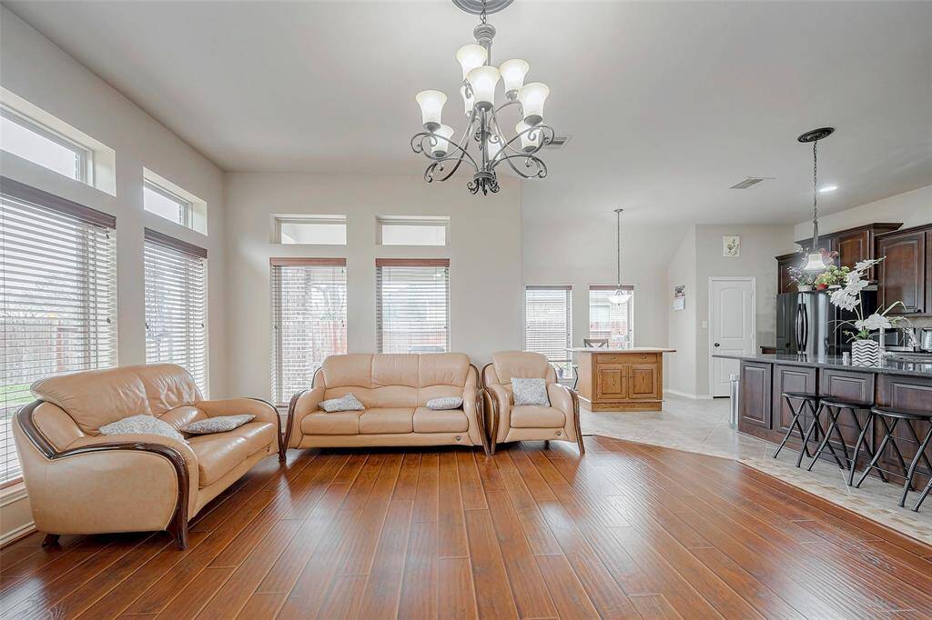 Plenty of natural lighting in the living room. Sofa set is included.
