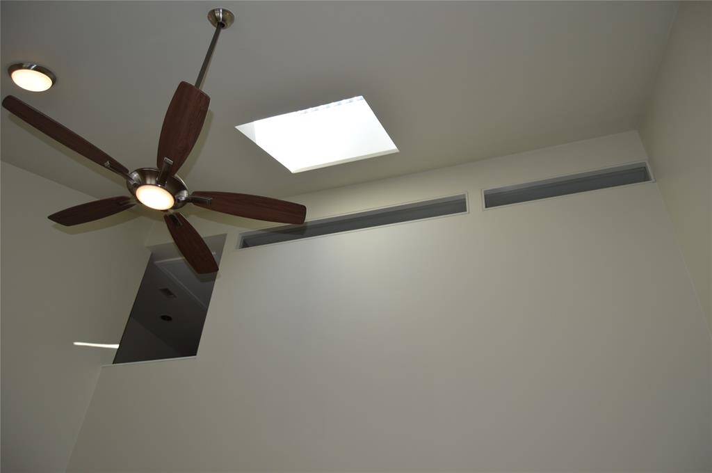 Vaulted ceiling with skylight add warmth feelingto this beautiful home.