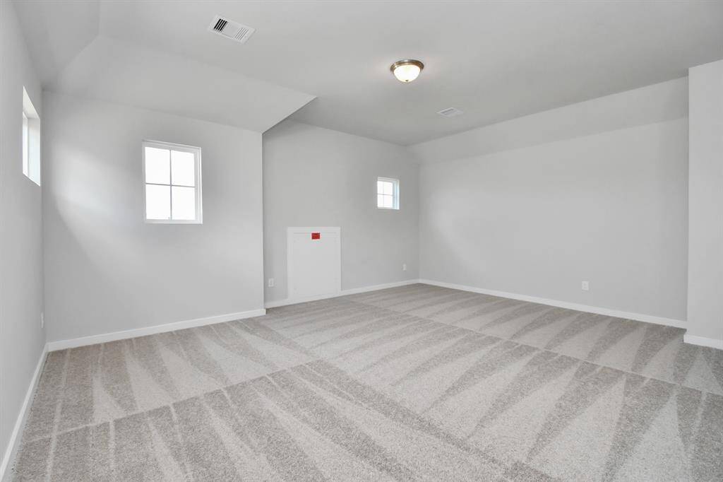 Another view of game room or additional living area. Sample photo of completed home. Actual colors and selections may vary.