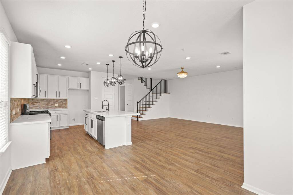 Open-concept floorplan with a seamless flow into the living room and breakfast area
