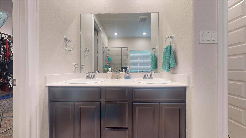Double sink vanity on primary bathroom.