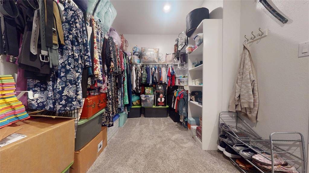 Primary walk-in closet.