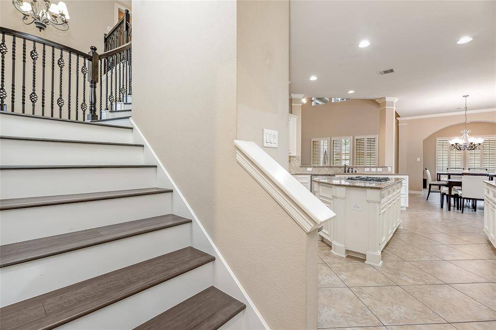 Lovely dual staircase with beautifully crafted wood steps.