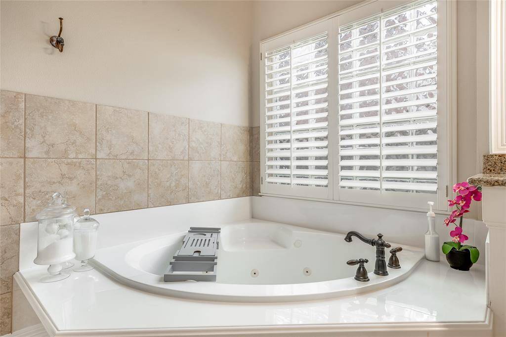 Luxurious, well-lit tub for ultimate relaxation.