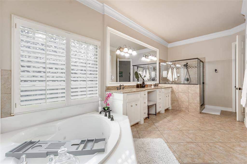 Experience ultimate luxury and spaciousness in this stunning primary bathroom.