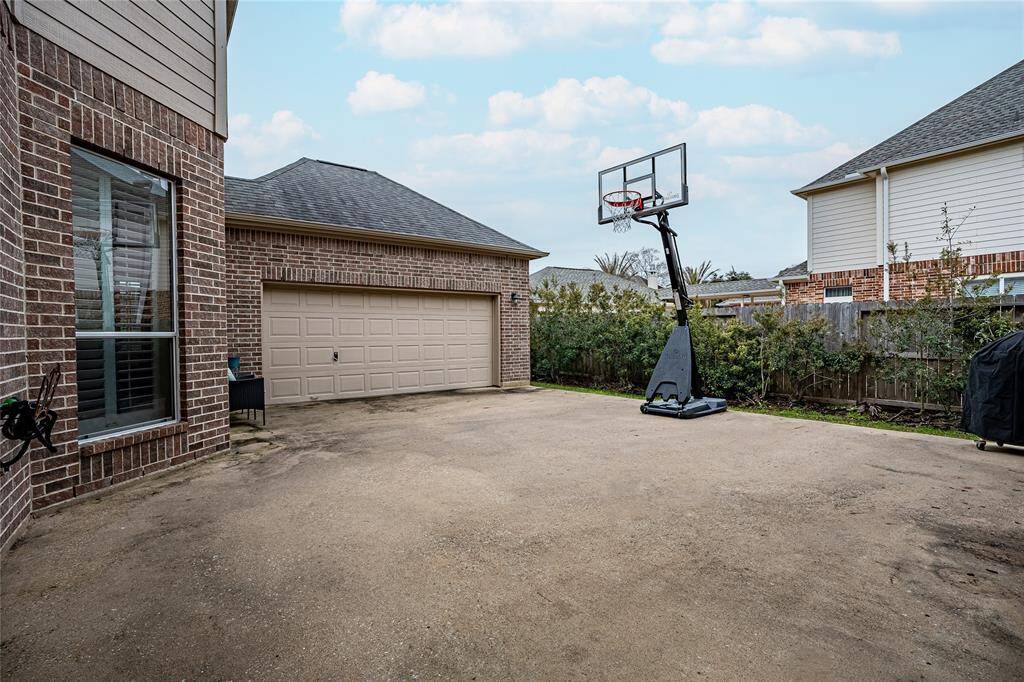 Discover a private courtyard within the secure, gated driveway.