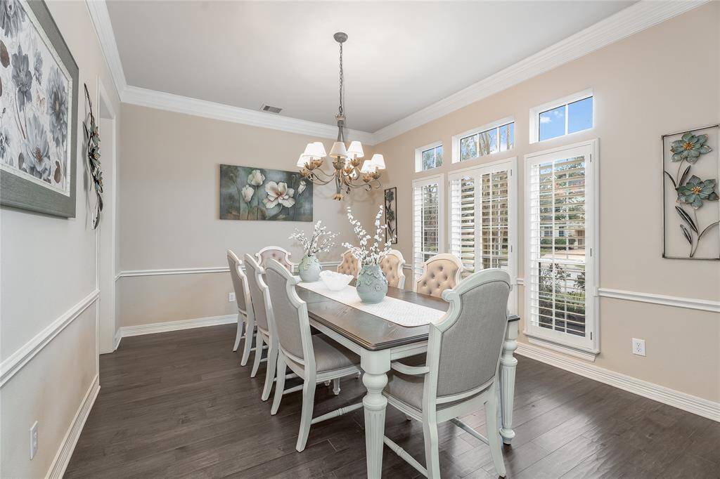 Elegant and spacious dining room filled with natural light, ideal for entertaining and family gatherings.