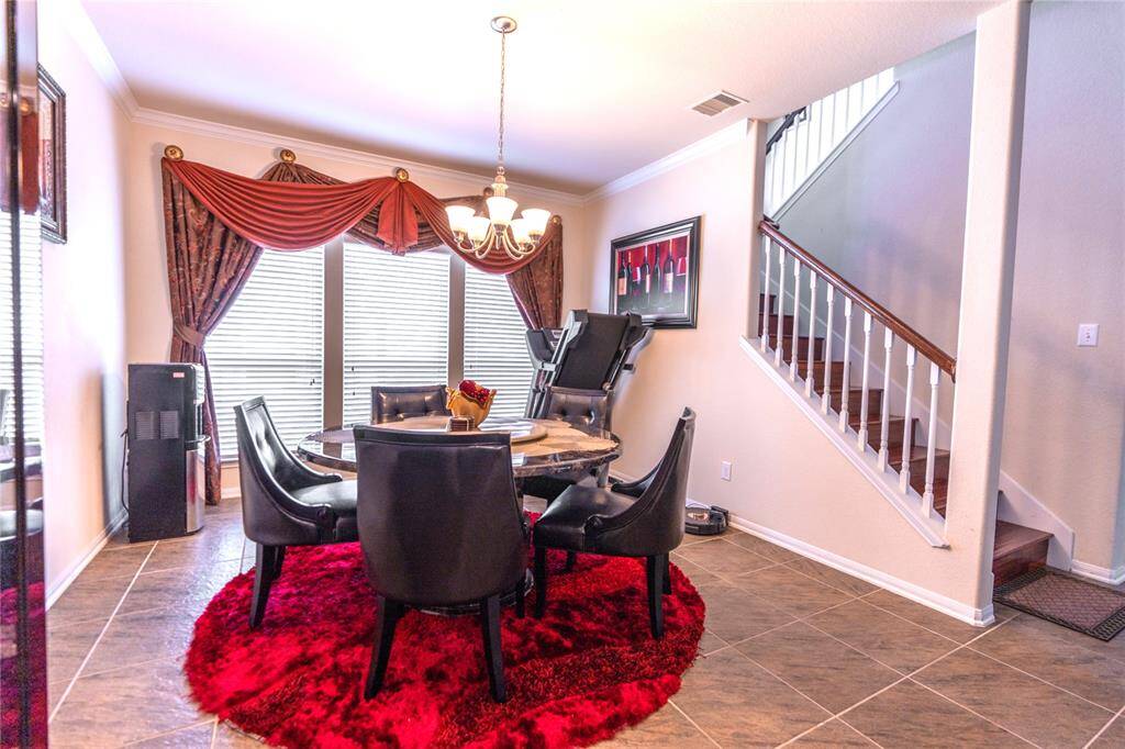 Elegant dining room with stylish decor, perfect for entertaining guests.