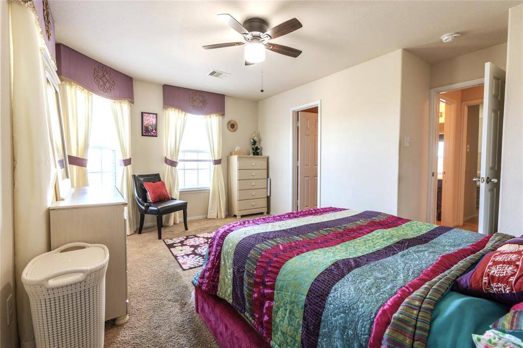 Spacious 5th bedroom with a walk-in closet and private bathroom.