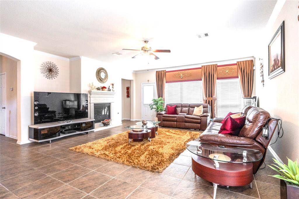Inviting family room greets you at the entrance, offering a cozy space for relaxation and gatherings.