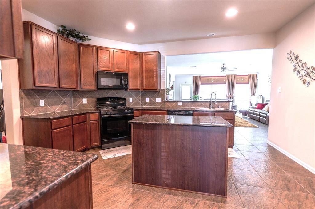 Seamlessly connected kitchen and family room for effortless entertaining.