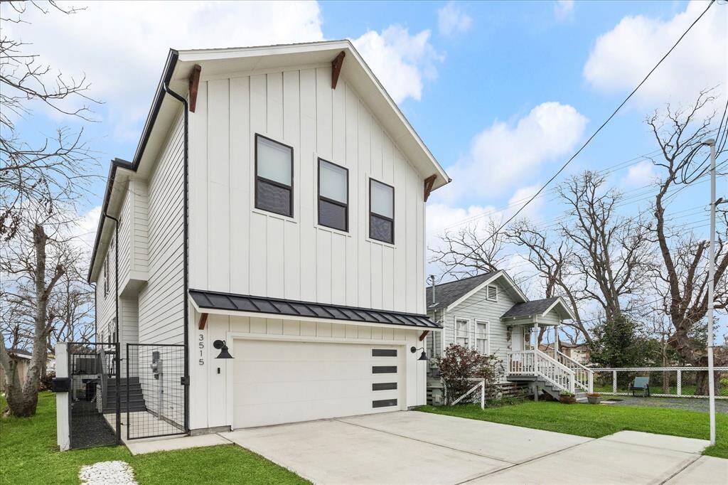 Modern farmhouse style home with batten board siding and metal roof accents. Gated entry, two car garage, full size driveway located at the dead end of the street.