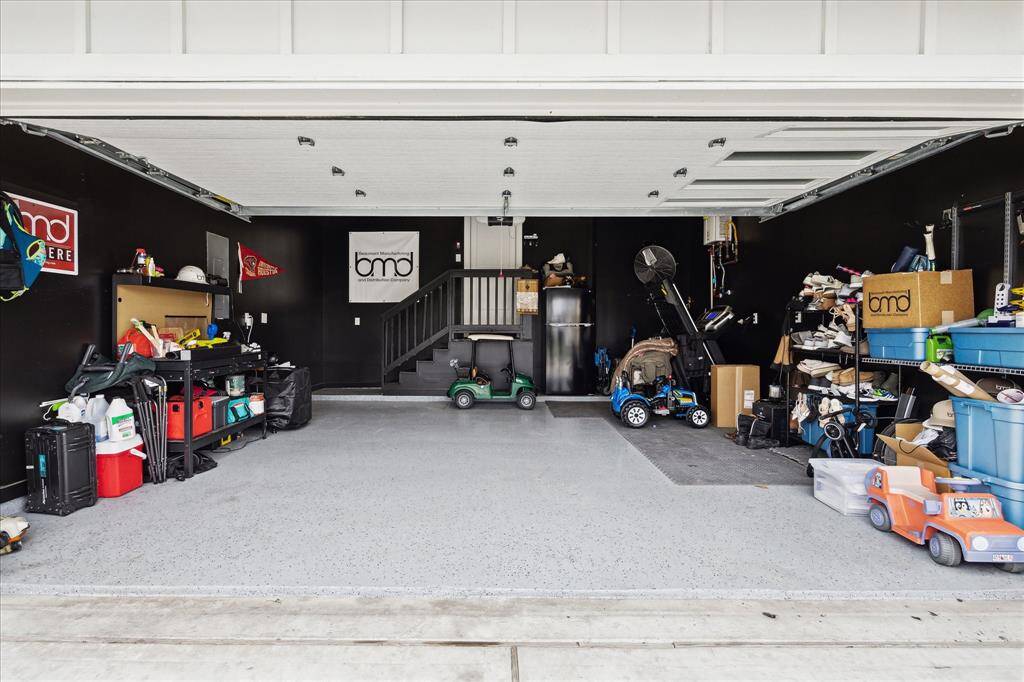 2 car garage with painted walls, epoxy floors and oversized for storage