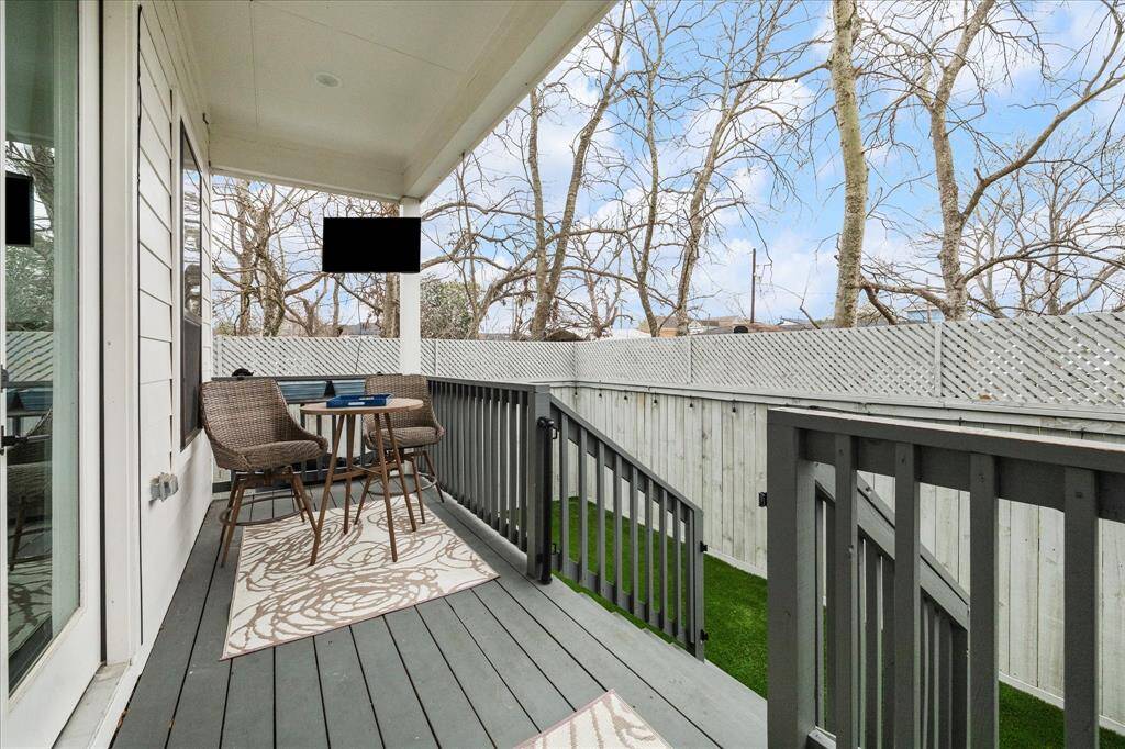 Backyard porch with ceiling fan