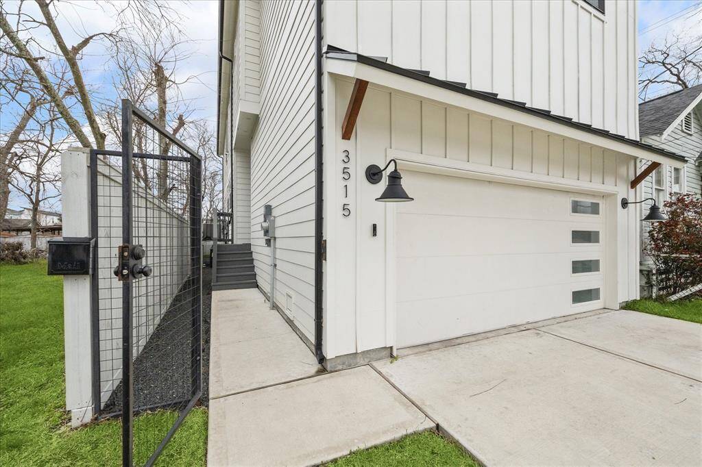 Private side entry with gate, black star gravel leading to side entry