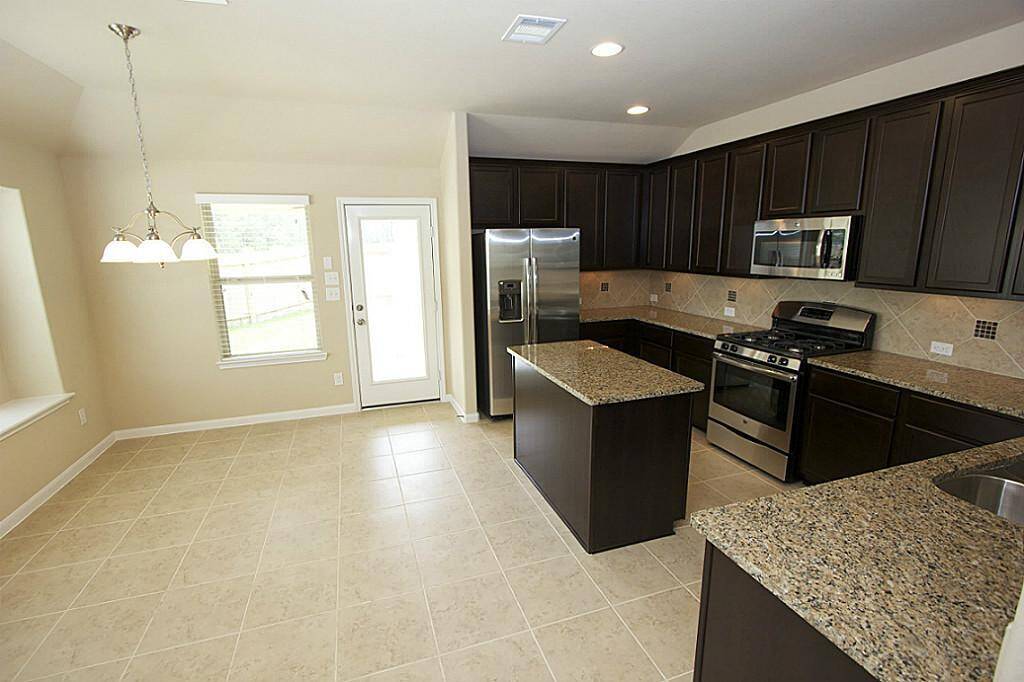 Tile and wood floors downstairs in the living areas