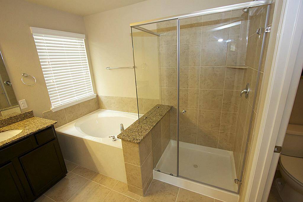 Separate tub and shower in the primary bath.